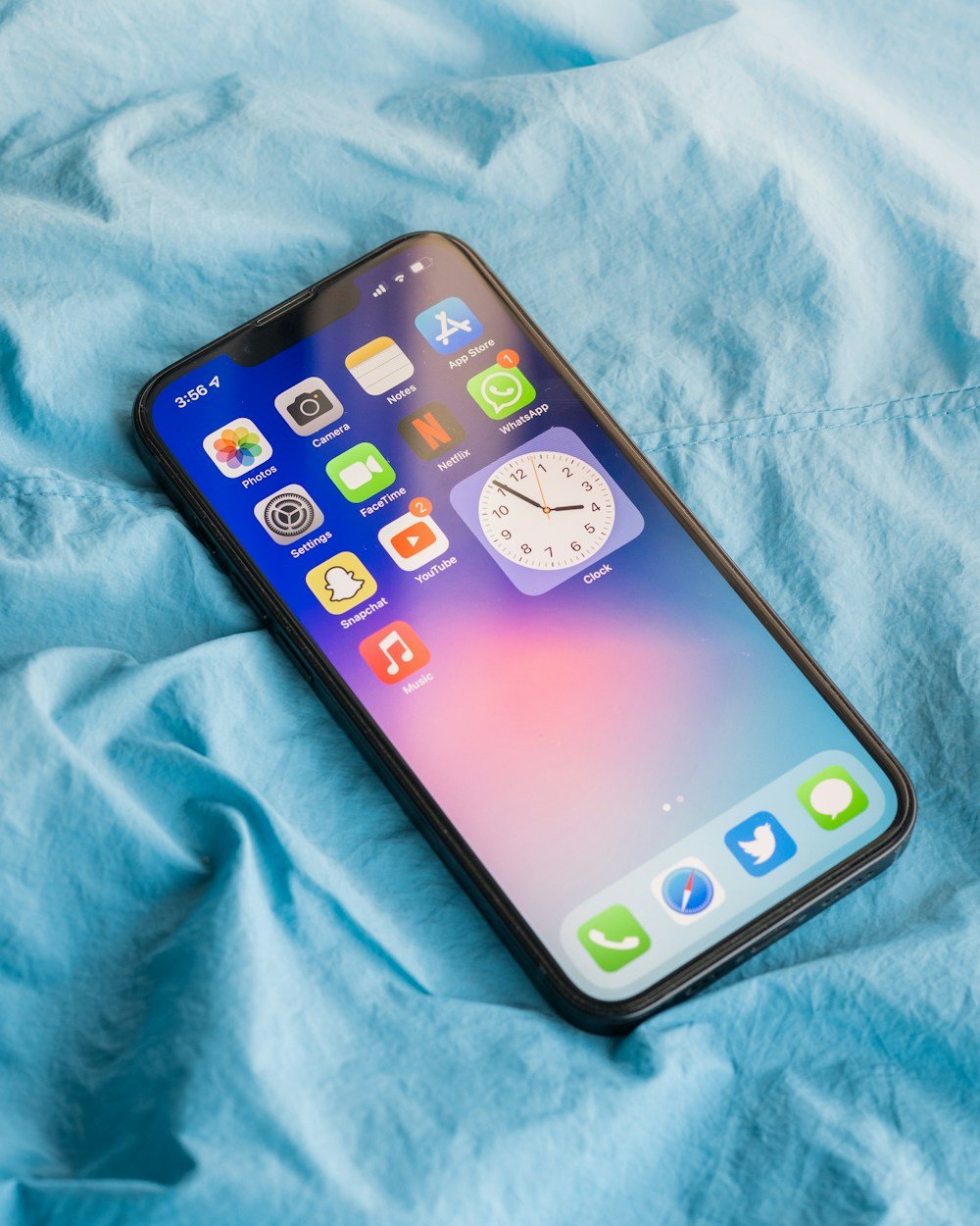 iPhone 13 on a blue blanket